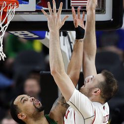 Utah Utes forward David Collette makes a bucket over Oregon Ducks guard Victor Bailey Jr. during the Pac-12 basketball tournament in Las Vegas on Thursday, March 8, 2018.