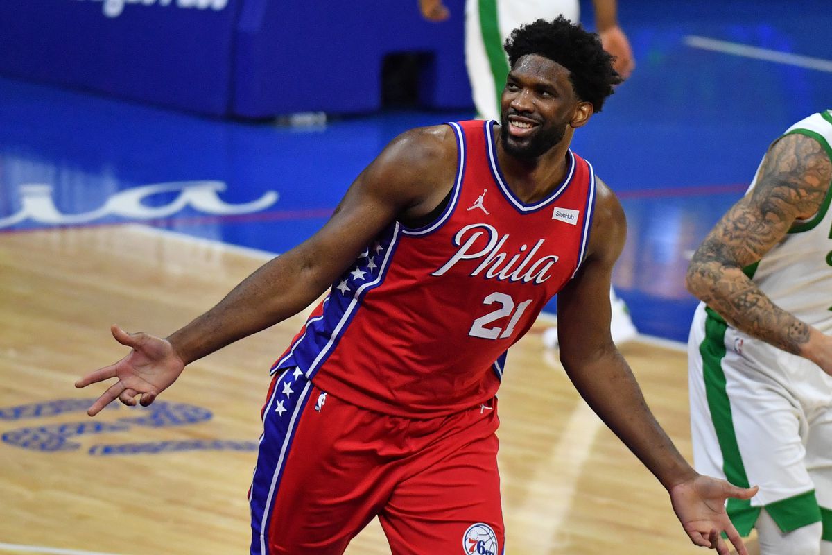 Philadelphia 76ers center Joel Embiid (21) celebrates after making a three point shot against the Boston Celtics during the fourth quarter at Wells Fargo Center.