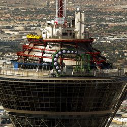 In this April 20, 2005, file photo, the green arm of the "Insanity" ride is seen atop the Stratosphere Tower in Las Vegas. The Stratosphere casino-hotel is hoping its mission to "Take Vegas Back" gets as much attention as its iconic 1,149-foot tall tower. The hotel launched the marketing campaign in Jan. 2015, poking fun at the Las Vegas Strip's slide into exclusivity with high-priced rooms, pricey fine-dining restaurants, bottle-service and red-velvet rope access.