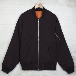 <strong>Fred Perry</strong> Quilted Bomber in Black, <a href="http://www.fredperry.us/quilted-bomber-j3271.html">$300</a>