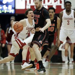 Washington State guard Malachi Flynn, left, is stopped by Utah forward David Collette, second from left, during the first half of an NCAA college basketball game Saturday, Feb. 17, 2018, in Pullman, Wash. (AP Photo/Ted S. Warren)