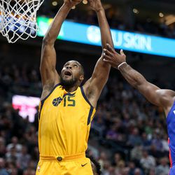 Utah Jazz forward Derrick Favors (15) pulls in a rebound during the game against the Detroit Pistons at Vivint Smart Home Arena in Salt Lake City on Tuesday, March 13, 2018.