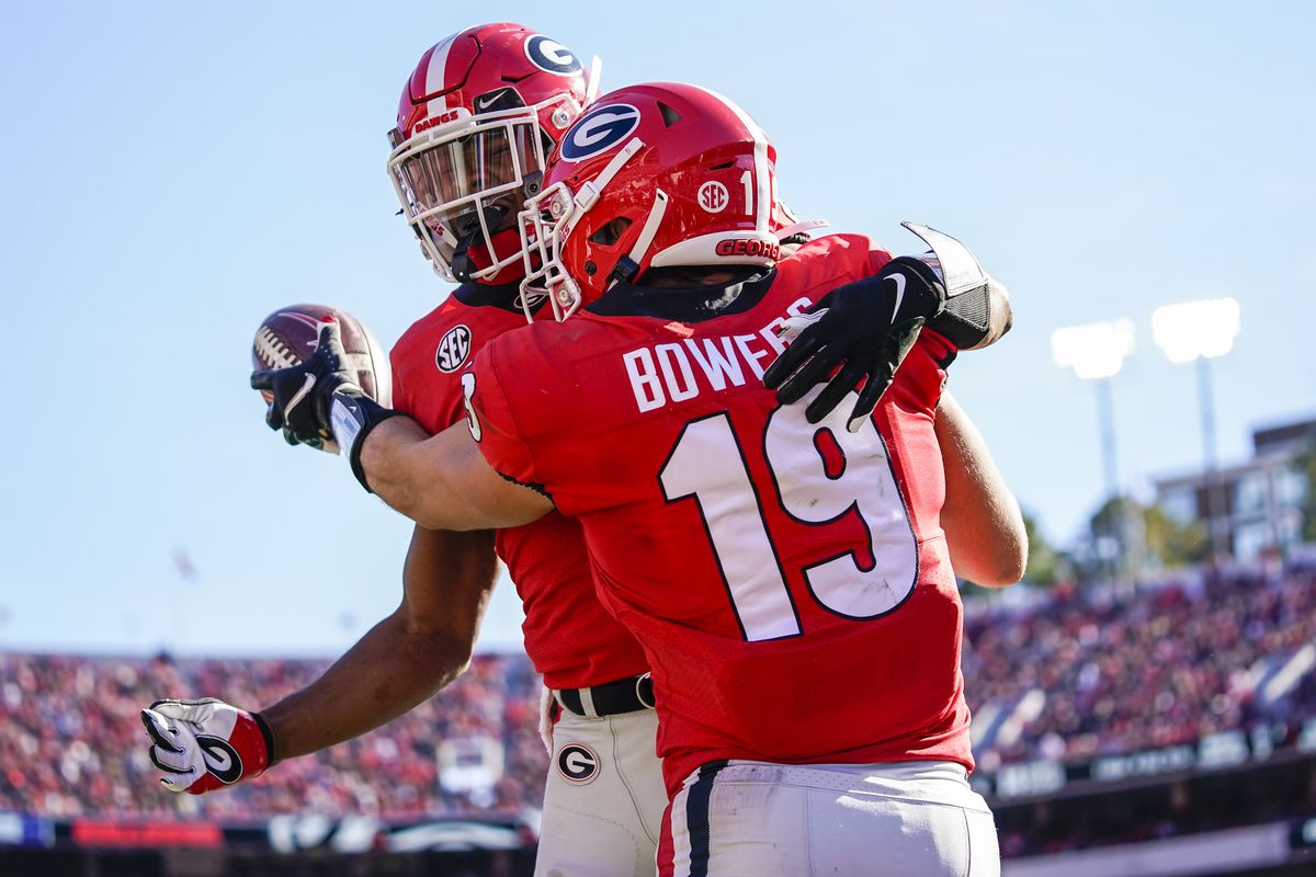 Georgia Bulldogs tight end Brock Bowers reacts with running back Kenny McIntosh after scoring a touchdown against the Charleston Southern Buccaneers during the first half at Sanford Stadium.