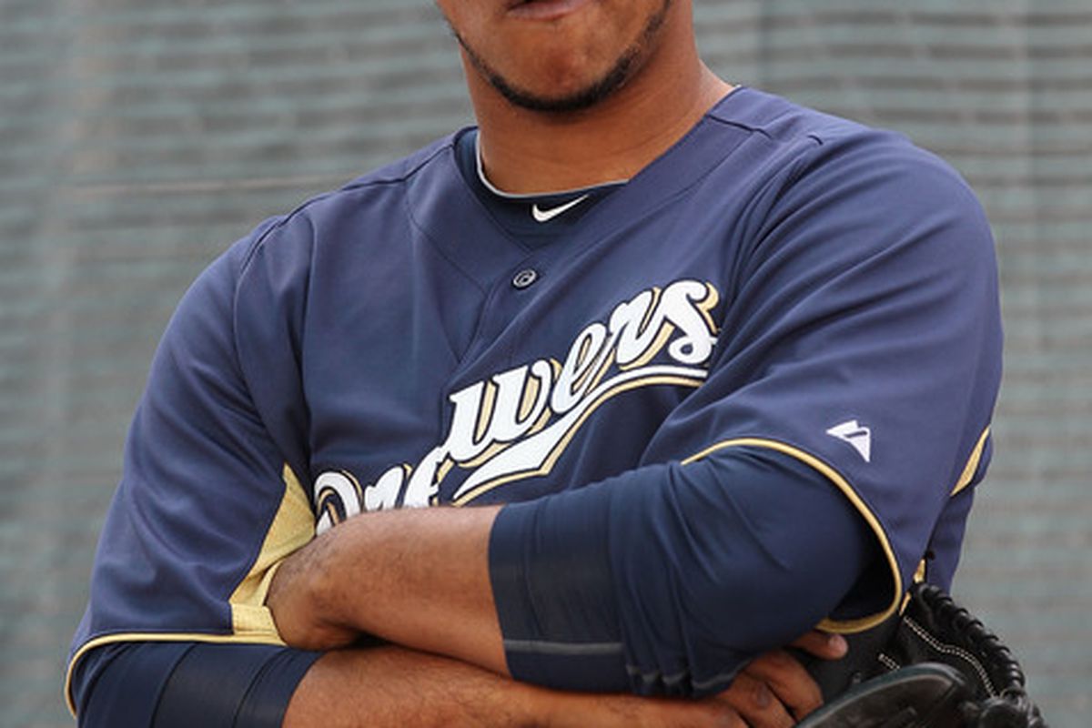 PHOENIX AZ - FEBRUARY 18:  Pitcher Wily Peralta #73 of the Milwaukee Brewers listens to coaches during a MLB spring training practice at Maryvale Baseball Park on February 18 2011 in Phoenix Arizona.  (Photo by Christian Petersen/Getty Images)