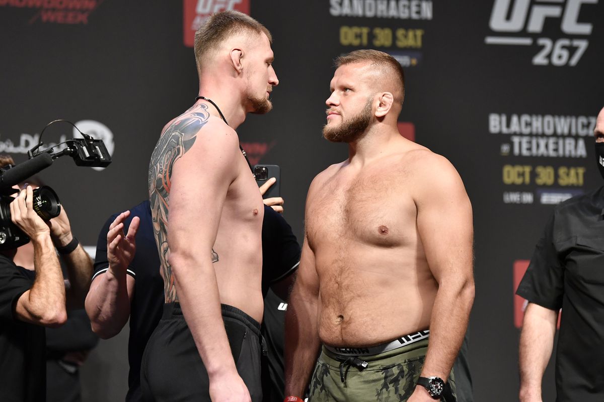 OCTOBER 29: (L-R) Opponents Alexander Volkov of Russia and Marcin Tybura of Poland face off during the UFC 267 ceremonial weigh-in at Etihad Arena on October 29, 2021 in Yas Island, Abu Dhabi, United Arab Emirates.