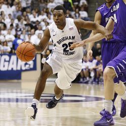 Brigham Young Cougars guard Anson Winder (20) drives as Brigham Young University defeats Portland 97-88 in NCAA men's basketball Monday, Dec. 29, 2014, in Provo.  
