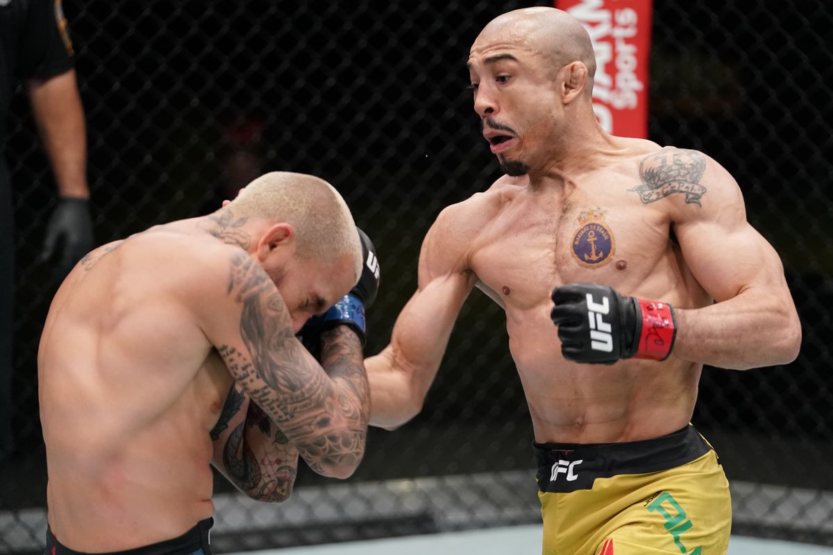In this handout image provided by UFC, (R-L) Jose Aldo of Brazil punches Marlon Vera of Ecuador in a bantamweight fight during the UFC Fight Night event at UFC APEX on December 19, 2020 in Las Vegas, Nevada.