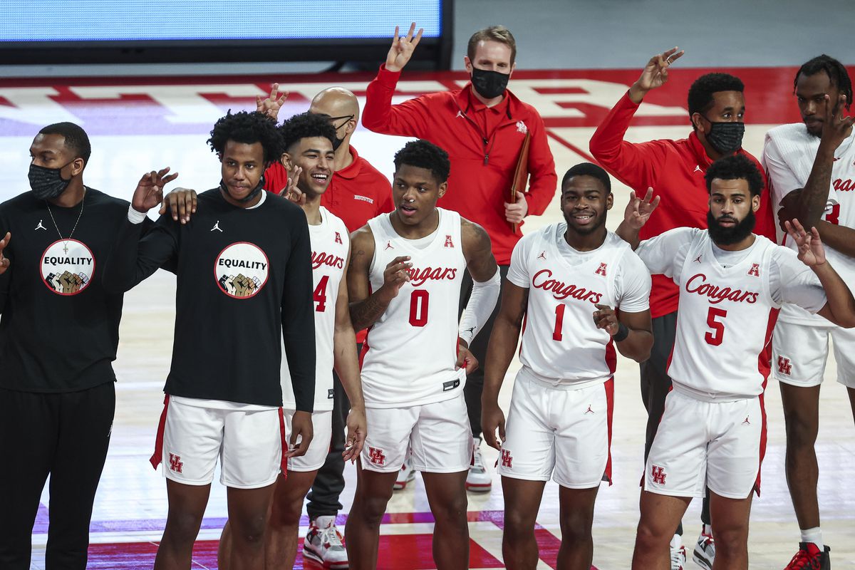 Houston Cougars guard Marcus Sasser celebrates with teammates after defeating the Southern Methodist Mustangs at Fertitta Center.