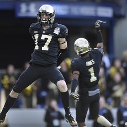 Wake Forest wide receivers Alex Bachman, left, and Tabari Hines celebrate a touchdown against Temple during the first half of the Military Bowl NCAA college football game, Tuesday, Dec. 27, 2016 in Annapolis, Md. 