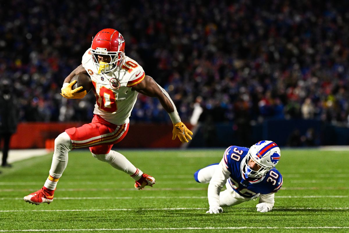 Isiah Pacheco #10 of the Kansas City Chiefs runs with the football during the second half of the AFC Divisional Playoff game against the Buffalo Bills at Highmark Stadium on January 21, 2024 in Orchard Park, New York.