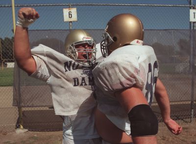 SF.Hell.14.bv.9–1/Notre Dame football player Craig Johnson, left, celebrates a good tackle near the
