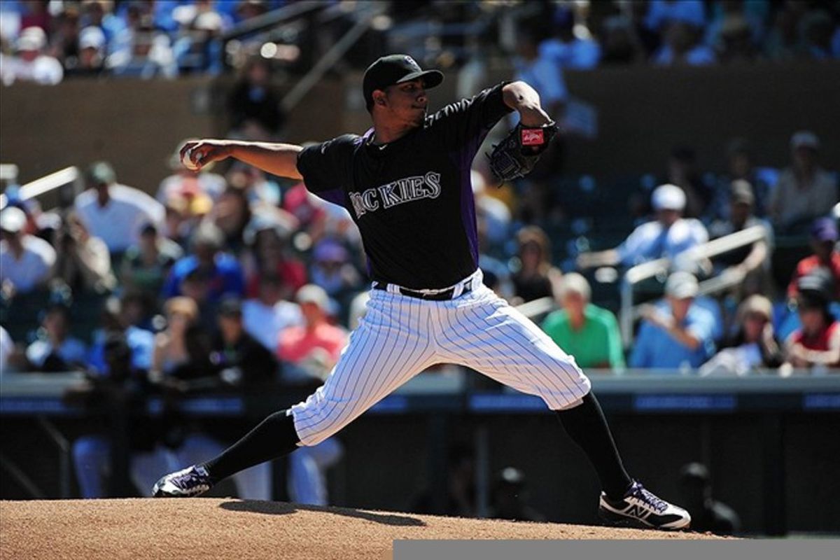 March 15, 2012; Scottsdale, AZ, USA; Colorado Rockies starting pitcher Jhoulys Chacin (45) delivers a pitch during the first inning against the Chicago Cubs at Salt River Fields. Mandatory Credit: Kyle Terada-US PRESSWIRE