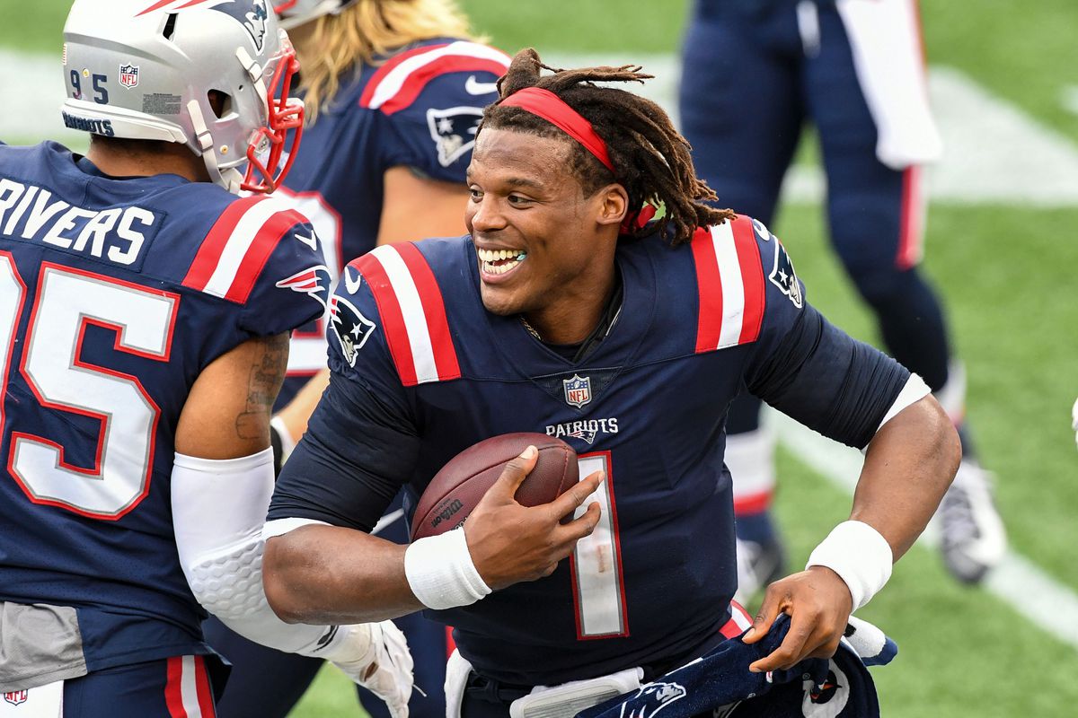 New England Patriots quarterback Cam Newton (1) celebrates after a touchdown scored by defensive end Deatrich Wise (not seen) against the Las Vegas Raiders during the fourth quarter at Gillette Stadium