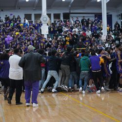 Waukegan’s fans rush the court in their win over Fremd. Wednesday  03-06-19. Worsom Robinson/For the Sun-Times.