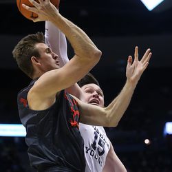 Brigham Young - Hawaii forward/center Jeff Given (31) is fouled by Brigham Young Cougars forward Payton Dastrup (15) as BYU and BYU-Hawaii play in preseason action at the Marriott Center in Provo on Wednesday, Nov. 9, 2016.