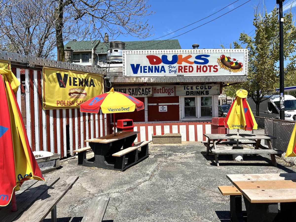 A hot dog stand’s patio area in the sun.