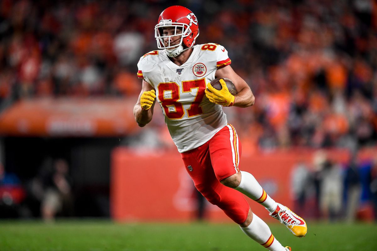 Travis Kelce of the Kansas City Chiefs carries the ball against the Denver Broncos in the third quarter at Empower Field at Mile High on October 17, 2019 in Denver, Colorado.