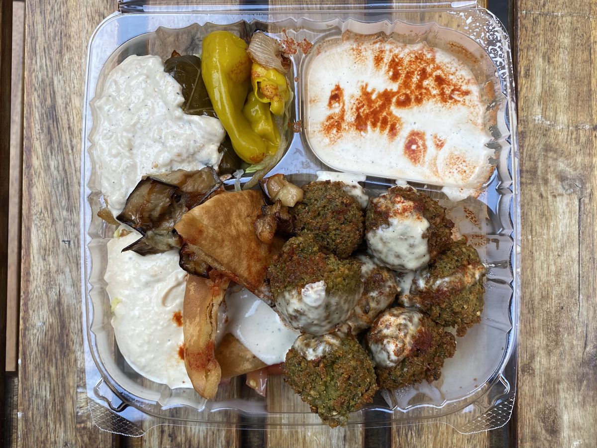 The falafel platter from Sam’s Falafel Stand in the Financial District, packed with hummus, pita, and balls of falafel.