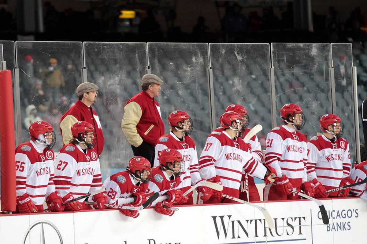 Assistant coach Gary Shuchuk (red jacket, left) will be joined at Wisconsin by his son, Alex. 