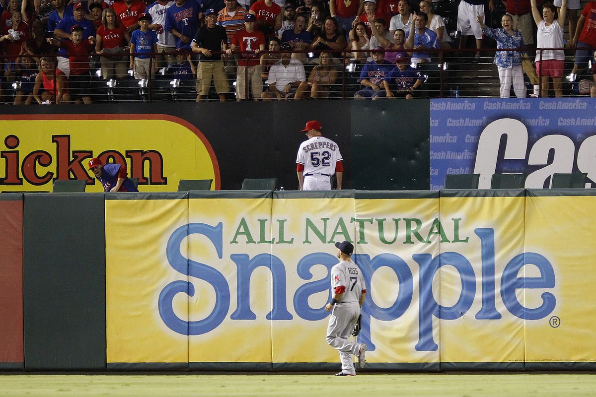 ARLINGTON, TX: Cody Ross #7 of the Boston Red Sox watches as the home run ball goes into the Rangers bullpen hit by Nelson Cruz #17 of the Texas Rangers at Rangers Ballpark in Arlington, Texas. (Photo by Rick Yeatts/Getty Images)
