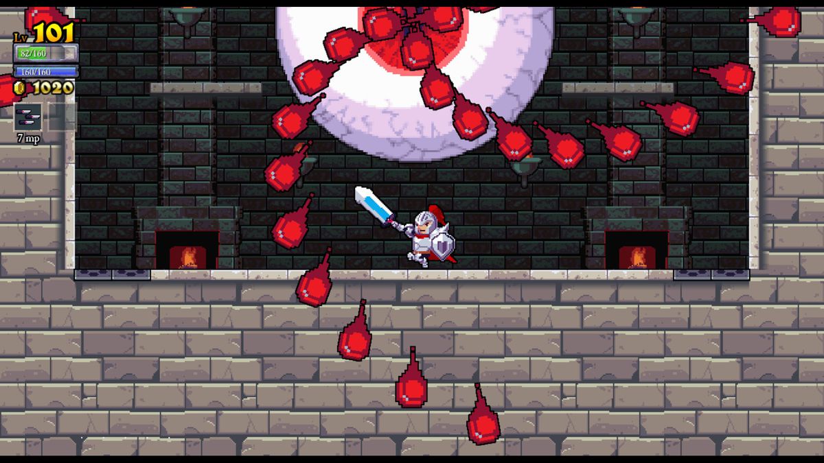 In a screenshot from Rogue Legacy, the knight fights a giant eyeball in a dungeon.