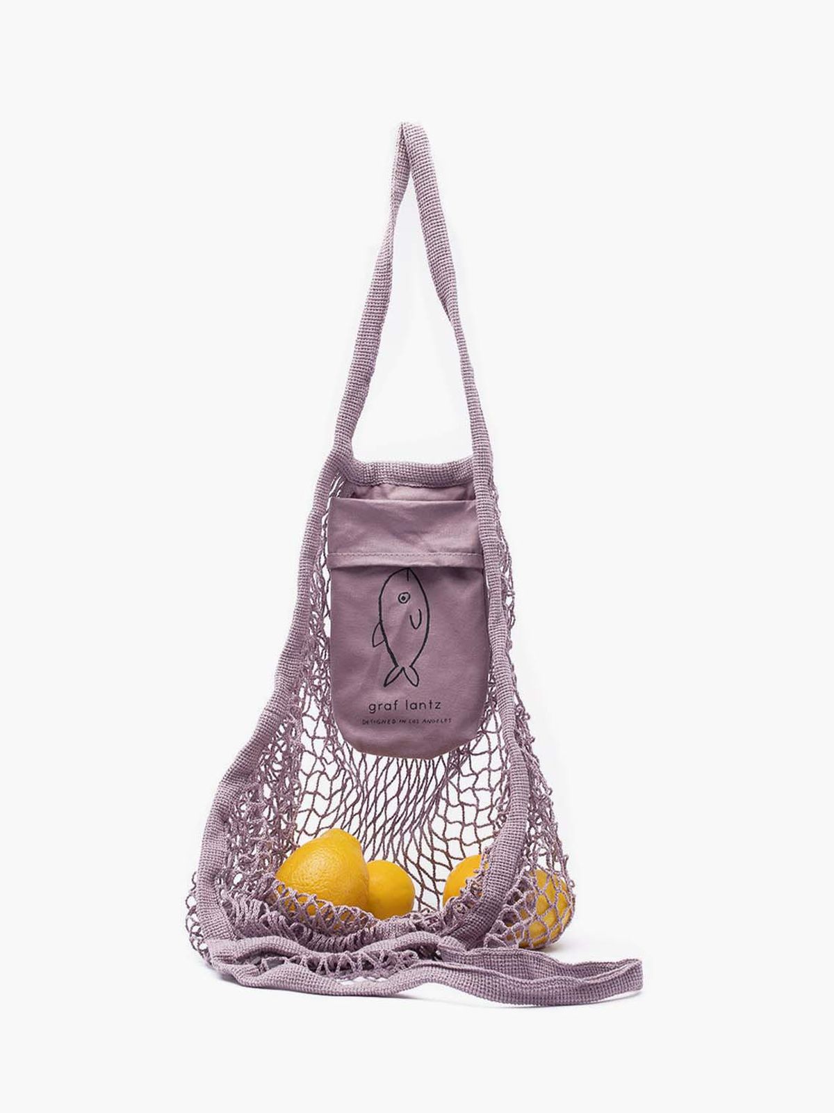 A net tote bag with a lemon