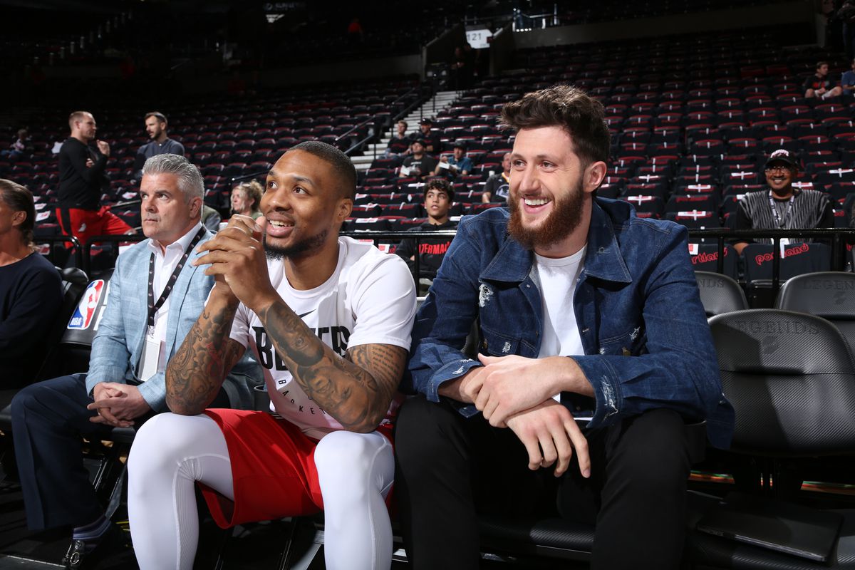 Damian Lillard and Jusuf Nurkic of the Portland Trail Blazers smile before the game against the Golden State Warriors in Game Three of the Western Conference Finals of the 2019 NBA Playoffs on May 18, 2019 at the Moda Center in Portland, Oregon