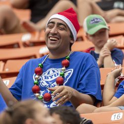 A BYU fan watches the first half of the team’s Hawaii Bowl NCAA college football game against Hawaii on Tuesday, Dec. 24, 2019, in Honolulu.