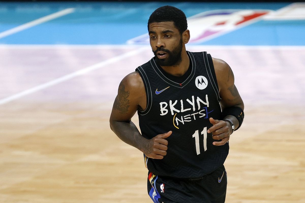 Kyrie Irving of the Brooklyn Nets runs the court during the fourth quarter of their game against the Charlotte Hornets at Spectrum Center on December 27, 2020 in Charlotte, North Carolina.