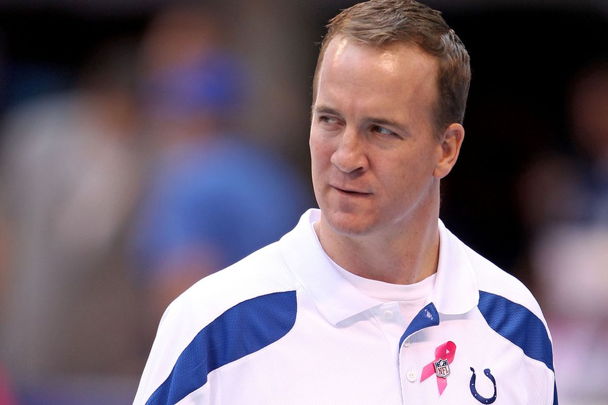 INDIANAPOLIS, IN - OCTOBER 09:  Peyton Manning of the Indianapolis Colts watches his team warm up before the NFL game against the Kansas City Chiefs at Lucas Oil Stadium on October 9, 2011 in Indianapolis, Indiana.  (Photo by Andy Lyons/Getty Images)
