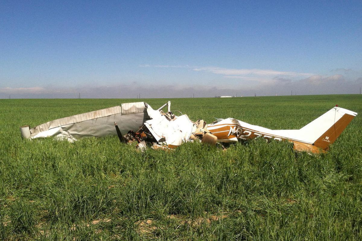 In this Saturday, May 31, 2014file photo provided by the Adams County, Colo., Sheriff's Department, the wreckage of small plane in scattered in a field near Watkins, Colo. The National Transportation Safety Board said Tuesday, Feb. 3, 2015, that taking "s