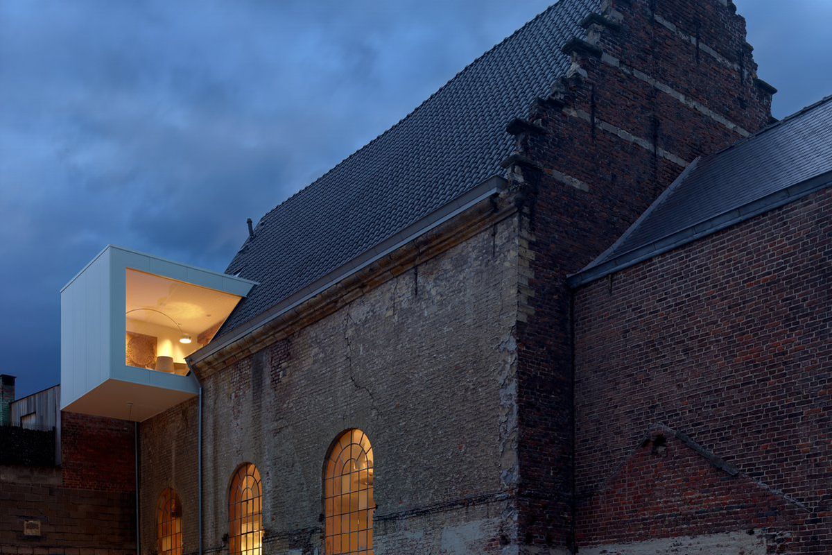 modern office inserted into historic brick chapel 