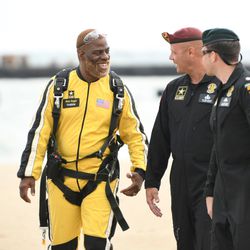 Rhymefest lands after his tandem jump with the U.S. Army Golden Knights. | Colin Boyle/Sun-Times