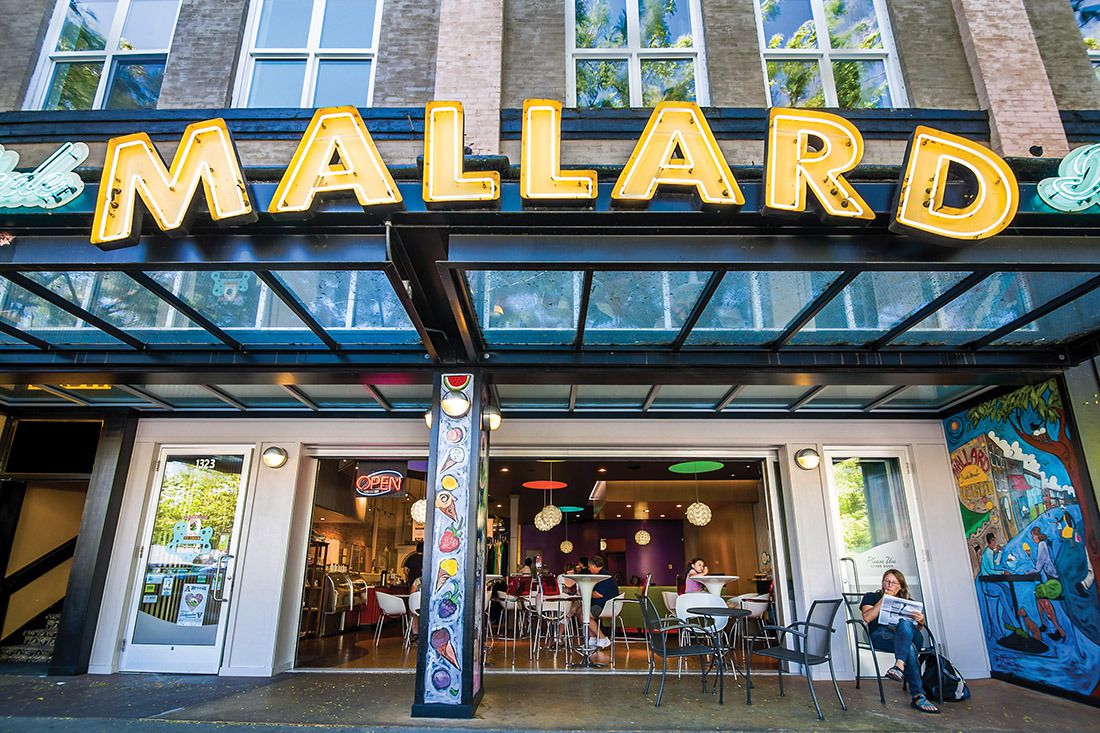 The exterior of Mallard Ice Cream, with the shop’s giant sign in gold displayed prominently.