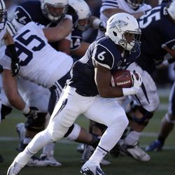 Nevada's Don Jackson (6) runs against BYU during the second half of an NCAA college football game in Reno, Nev., on Saturday, Nov. 30, 2013. BYU won 28-23.