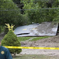 A house collapsed at 915 Canyon Road after a canal break sent water and debris into the area, Saturday, July 11, 2009. 