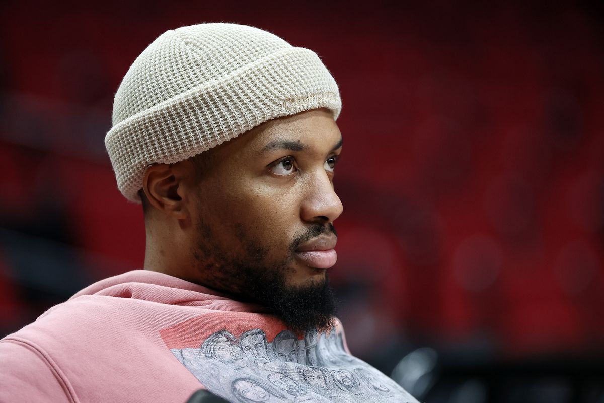 Damian Lillard # 0 of the Portland Trail Blazers looks on from the bench prior to the game against the Miami Heat at Moda Center on January 05, 2022 in Portland, Oregon.&nbsp;