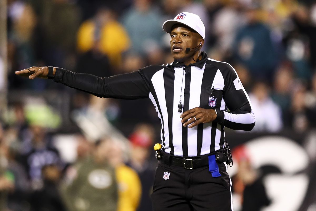 Referee Shawn Smith #14 signals for a penalty during an NFL football game between the Philadelphia Eagles and the Green Bay Packers at Lincoln Financial Field on November 27, 2022 in Philadelphia, Pennsylvania.