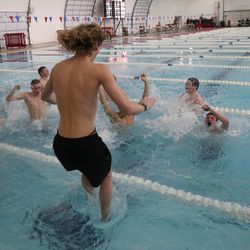 American Fork swimmers celebrate their team win during the 6A boys swim championship at Kearns Oquirrh Park Fitness Center in Kearns on Saturday, Feb. 20, 2021.