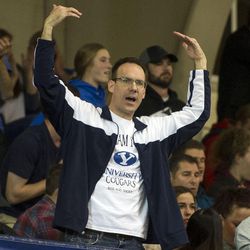 A BYU fan pumps his arms during an NCAA volleyball playoff game between BYU and UNLV in Provo on Saturday, Dec. 3, 2016. BYU swept UNLV 3-0 to advance to the Sweet 16.