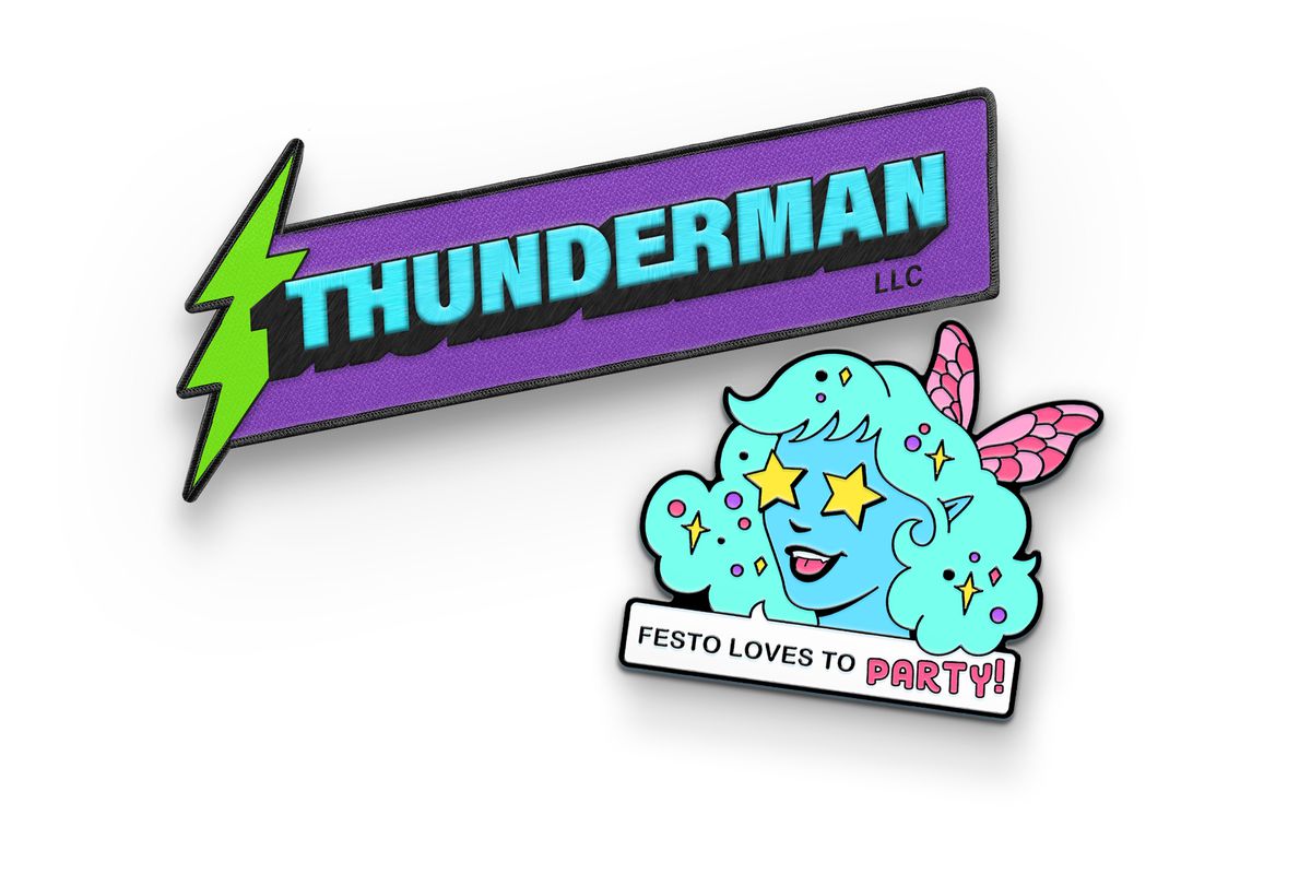 Image of the two December McElroy merch items. At the top is a purple patch with a green thunderbolt that says “Thunderman” in light blue with a drop shadow. Beneath the drop shadow is an “LLC” mark. Below the patch is an enamel pin of a blue fairy with fluffy teal hair saying, “Festo loves to party!” Festo has pink butterfly wings. 