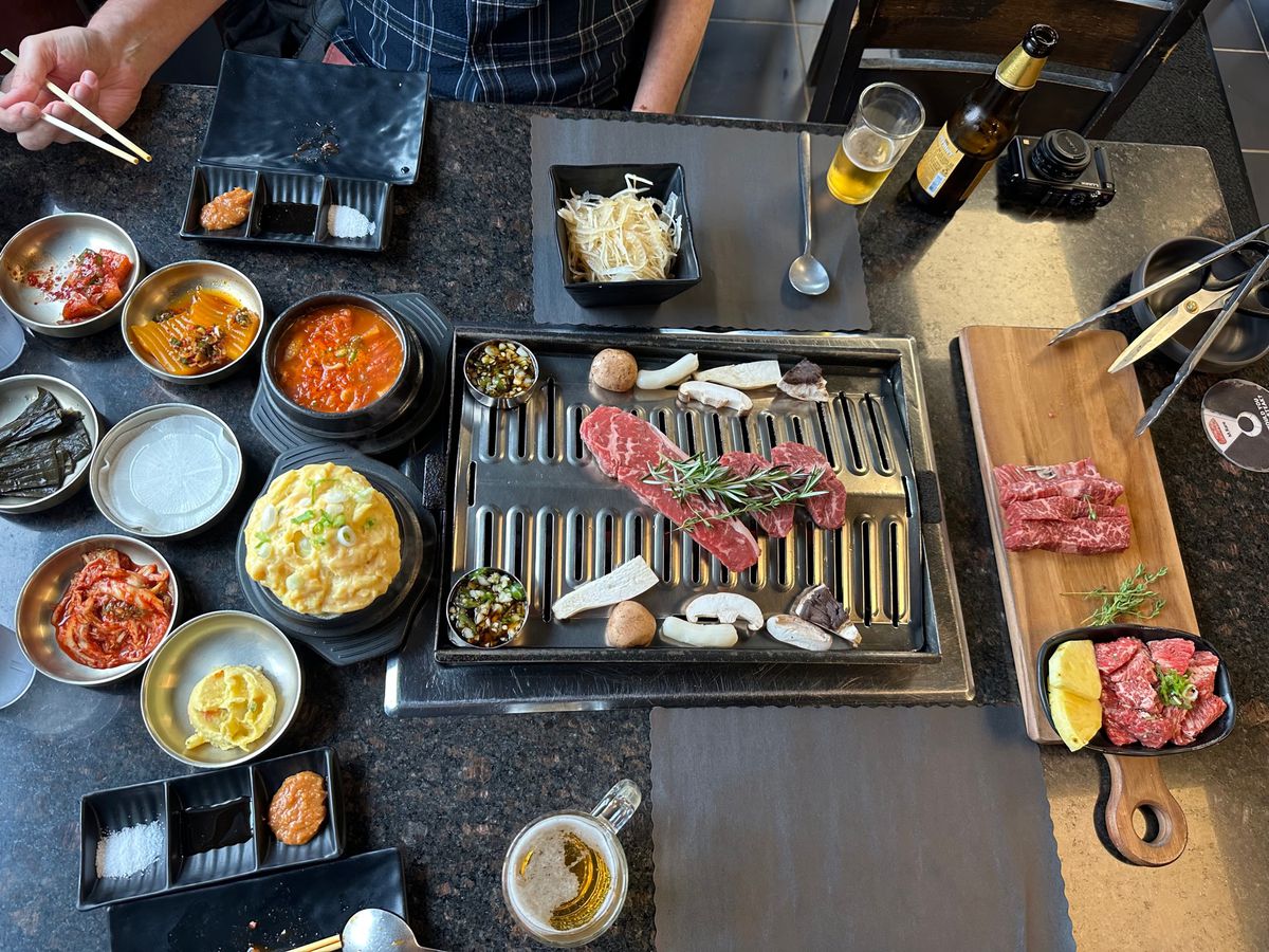 Korean barbecue at Wooga, with a grill in the center of the table.