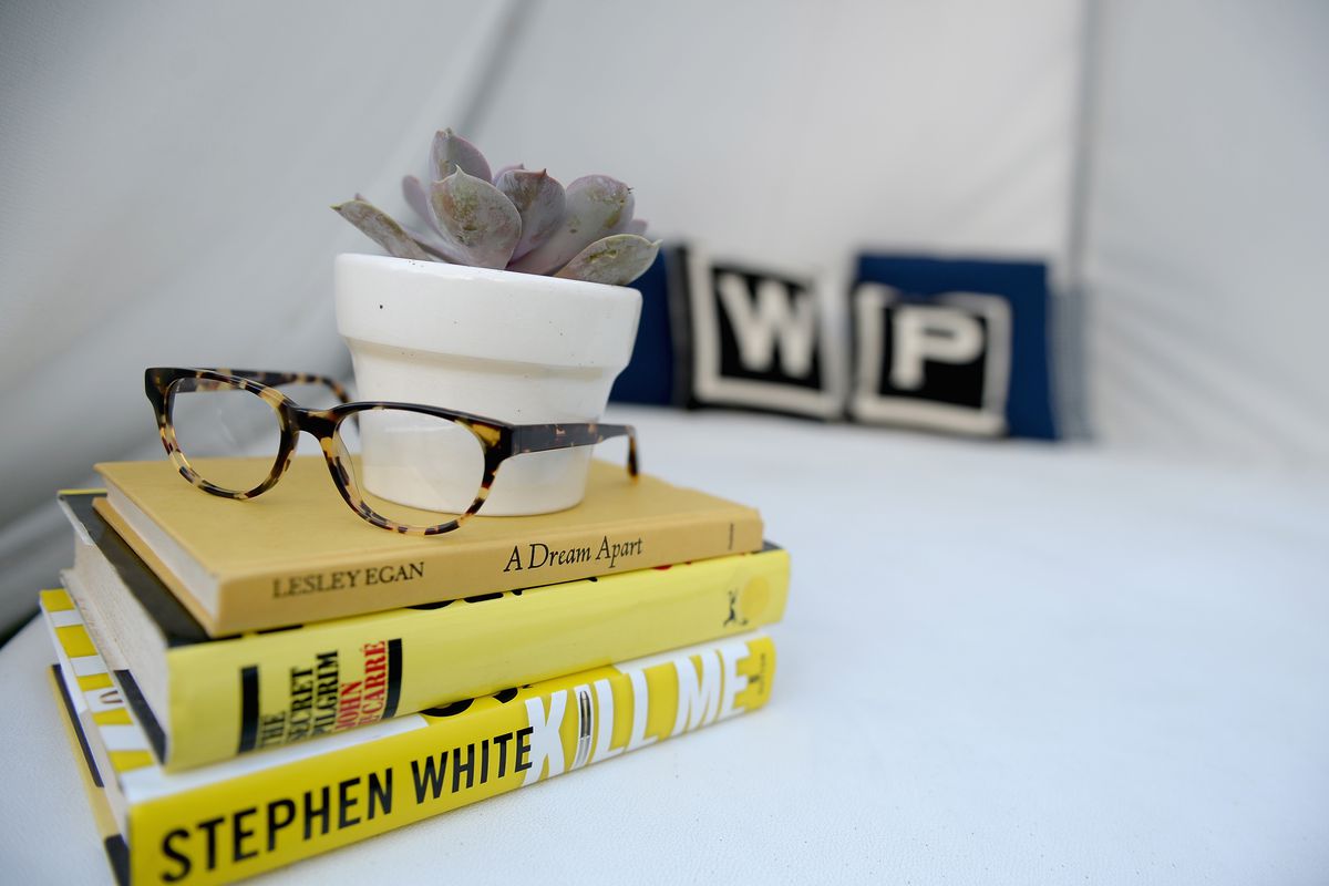 Warby Parker glasses resting on books