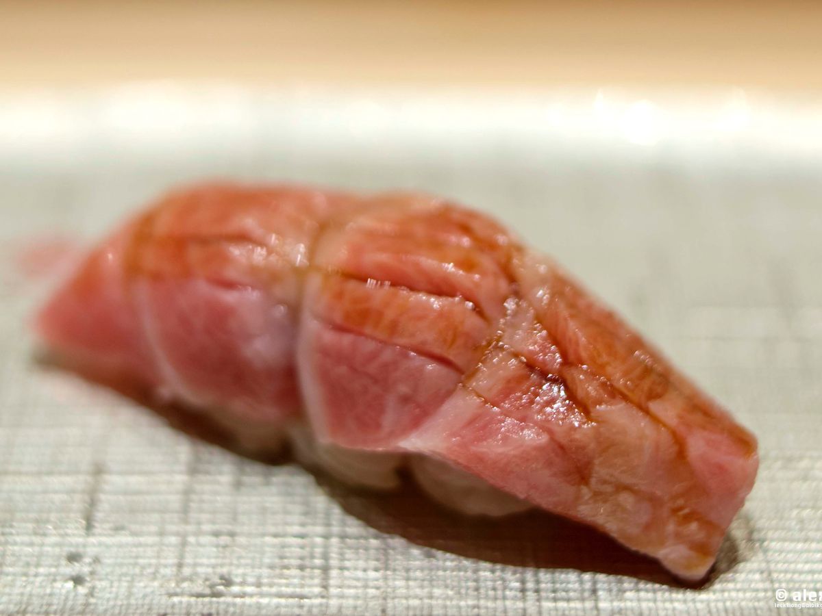 A closeup on a piece of marbled nigiri.