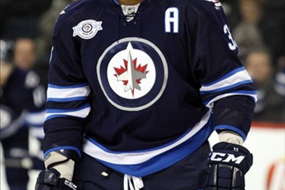 Mar 1, 2012; Winnipeg, MB, CAN; Winnipeg Jets defenseman Dustin Byfuglien (33) prior to the game against the Florida Panthers at the MTS Centre. Mandatory Credit: Bruce Fedyck-US PRESSWIRE