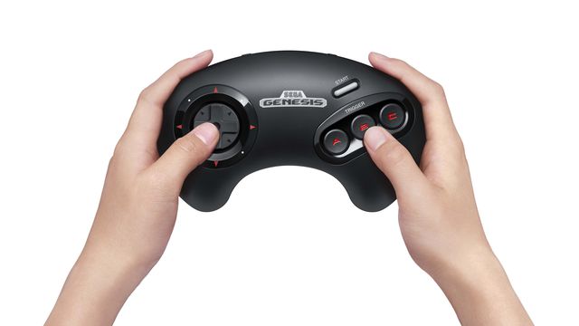 two hands holding a Sega Genesis controller for the Nintendo Switch 