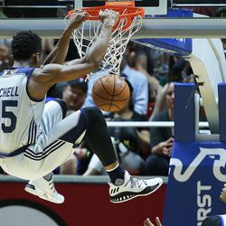 Utah Jazz guard Donovan Mitchell (45) goes high for a dunk as the Utah Jazz and the Philadelphia 76ers play in Summer league action in the Huntsman Center at the University of Utah in Salt Lake City on Wednesday, July 5, 2017.