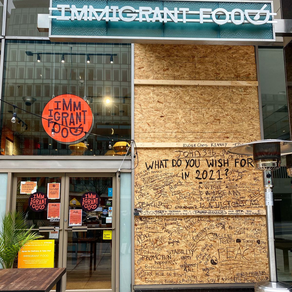Fast-casual spot Immigrant Food turned its boarded-up windows into a “Wish Wall” for 2021.