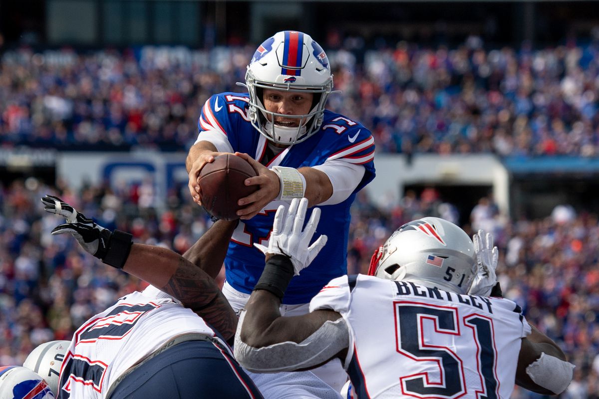 Buffalo Bills quarterback Josh Allen runs the ball in for a touchdown during the third quarter against the New England Patriots at New Era Field.