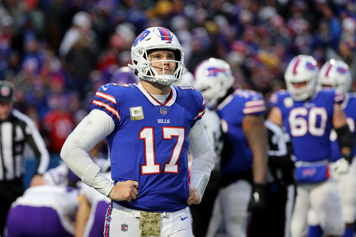 Bills quarterback Josh Allen walks of the field after fumbling the snap that turned into a Vikings touchdown.